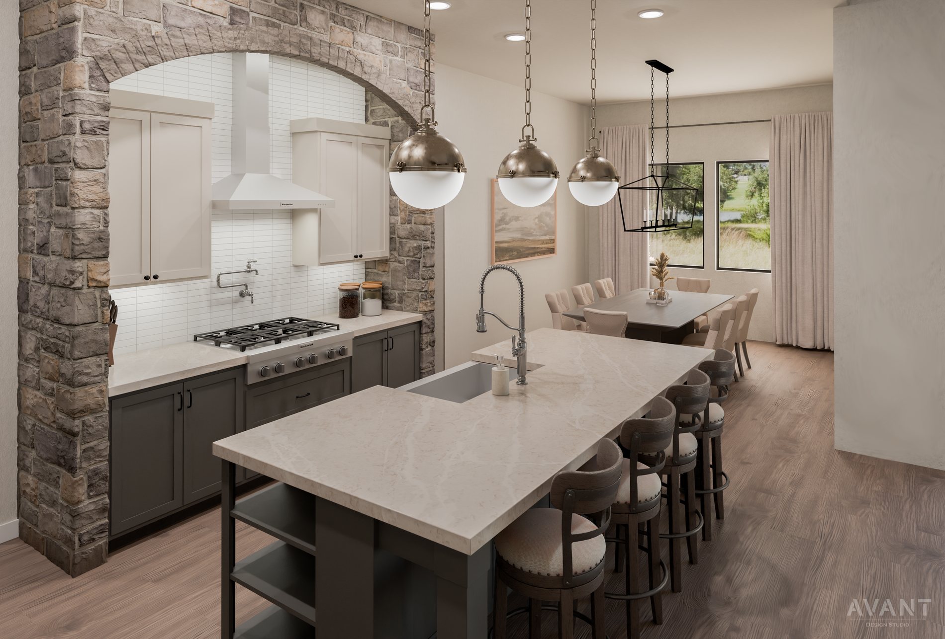 Kitchen framed by a stone arch with nickel globe pendants and dining beyond